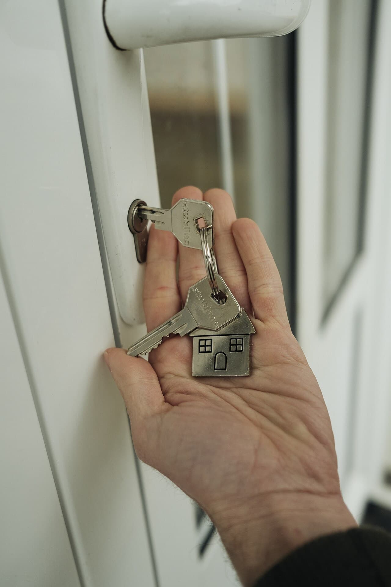 House keys handed over at a front door